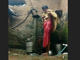 Indian aunty's open-air bathing