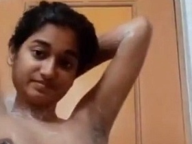 Nude Indian teenager takes a bathroom selfie