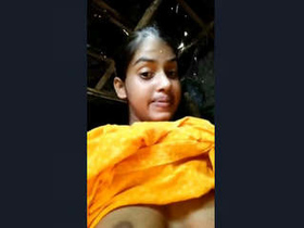 A beautiful Indian girl flaunts her breasts and vagina in a seductive manner