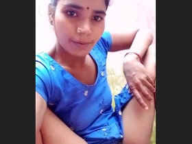 Indian wife shows off her hairy and moist pussy while wearing a blue outfit