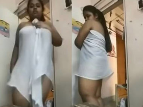 A towel-wrapped Desi beauty performs a sensual toy dance