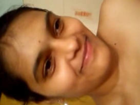 Indian beauty strips to nude in bathroom self-shot video