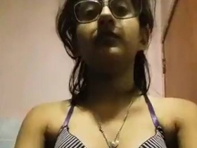 Watch a cute Indian girl undressing and showing off her body