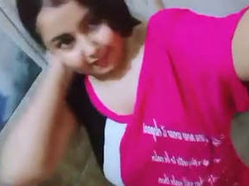 A highly aroused girl displays her breasts in a bathroom