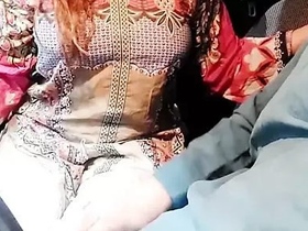 A genuine Indian girlfriend's milky breasts are pleasured in a car with Hindi commentary