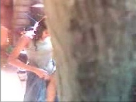 Hidden camera captures sexy village girl changing clothes in the outdoors