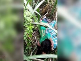 Indian couple enjoys outdoor sex on a grassy field