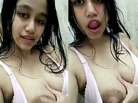 Sensual Asian teen reveals her assets in self-shot images