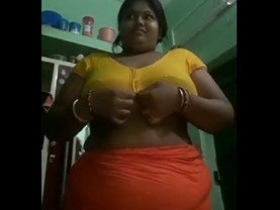 Mature Indian woman shows off her big boobs