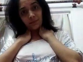 Big boobed Indian girl strips and teases in solo video