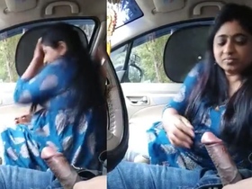 A sultry Indian woman performs oral sex with her partner in a vehicle, captured on personal footage