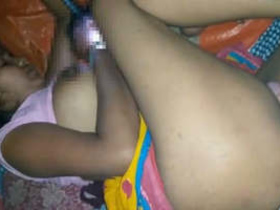 An Indian couple engages in sexual activity while the wife is distracted by her mobile phone