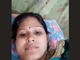 Indian aunty reveals her large breasts while taking a bath