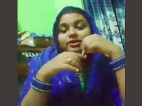 Busty Odia babe sings and plays with her pussy