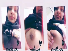 Watch a sweet hijabi girl flaunt her ample bosom on camera