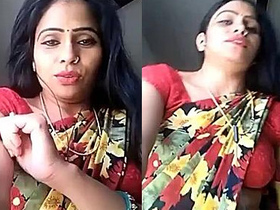 Young woman reveals her belly button in a seductive saree