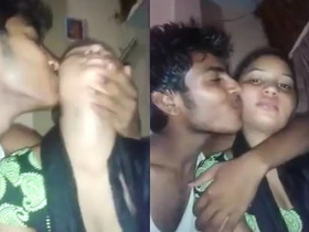 Desi girl squeezes her cousin's boobs and kisses her in a steamy video