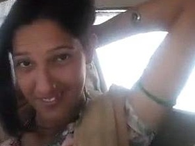Watch a cute girl suck on boobs in a car