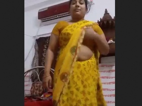 Stunning bhabhi strips and records herself in sari for her lover's enjoyment