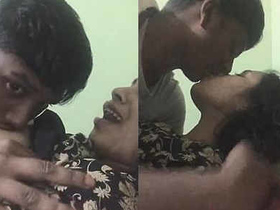 Desi couple indulges in passionate kissing and breast play