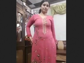 Pakistani beauty flaunts her dress and curves in a sexy striped suit