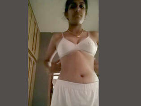 A cute Desi girl in the nude takes a selfie