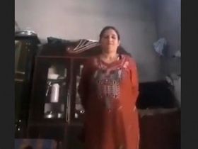 Pakistani babe removes clothes to show her big tits and pussy