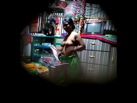 Hidden camera captures Desi bhabhi's big boobs in steamy video